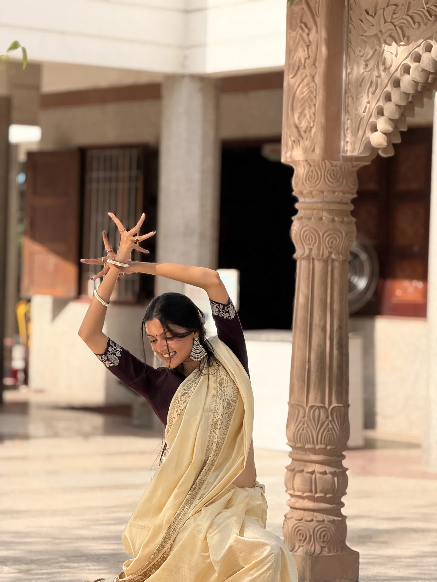 Shreya Gautam dancing in a temple courtyard